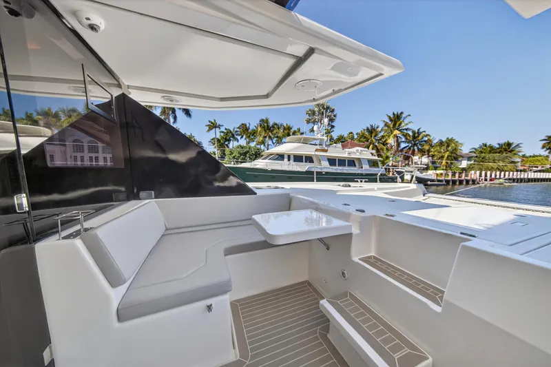 Slide: The Image of Spacious deck area of 2022 Leopard 50 yacht with seating and open door. - 47
