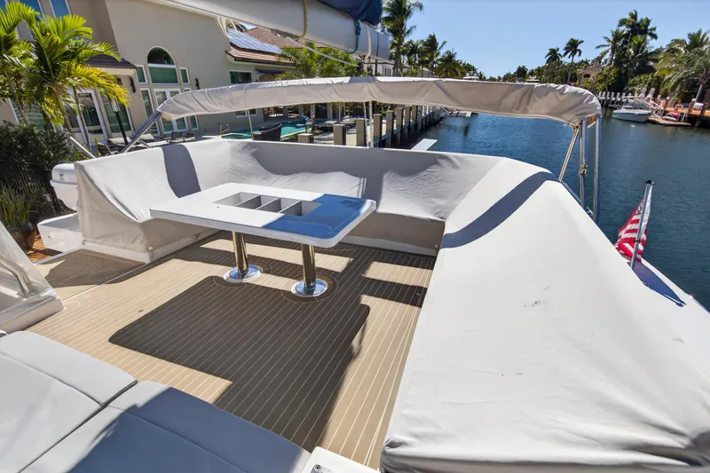 Slide: The Image of Luxurious 2022 Leopard 50 yacht interior with modern seating and dining area. - 5