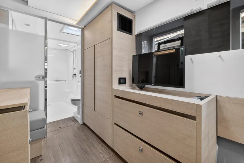 Slide: The Image of 2022 Leopard 50 yacht deck with modern design and lush surroundings. - 64