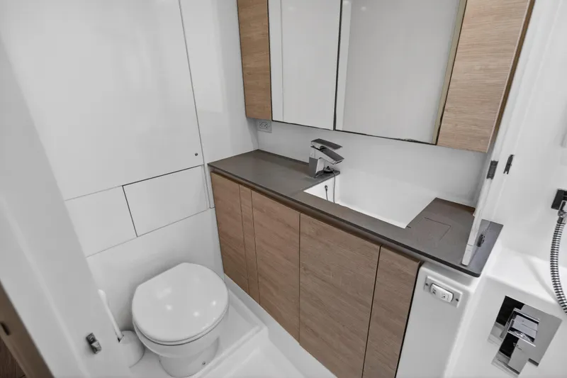 Slide: The Image of Navigation station on 2022 Leopard 50 yacht with communication equipment and control panel. - 79