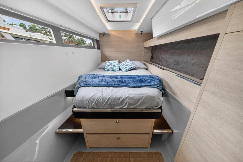 Slide: The Image of Interior of 2022 Leopard 50 yacht with navigation station and outdoor view. - 80