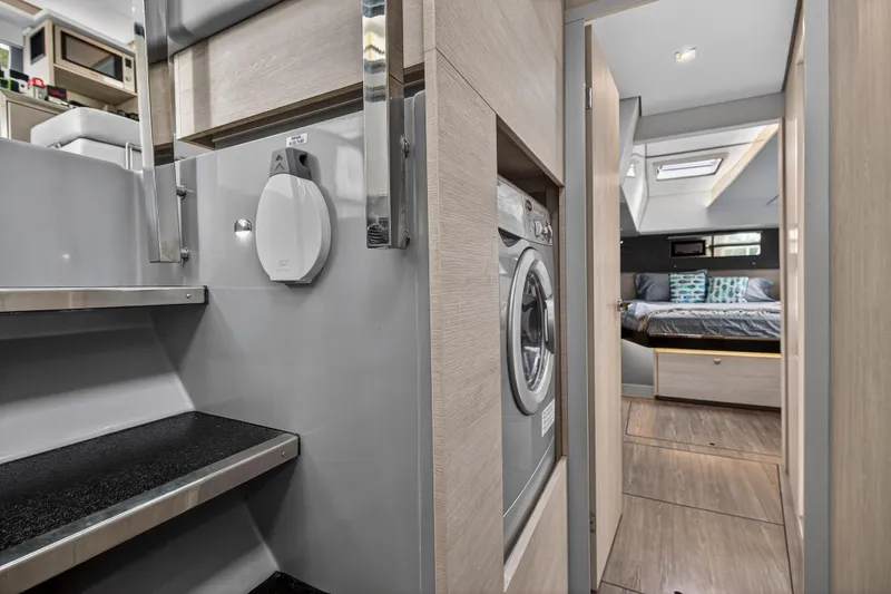 Slide: The Image of Modern yacht kitchen interior with stainless steel appliances, Leopard 50 model, 2022. - 83