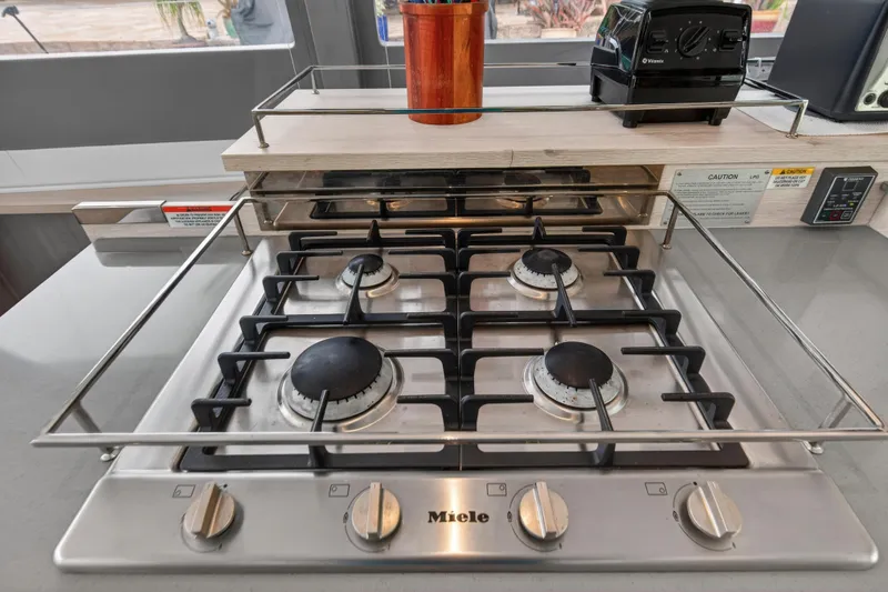 Slide: The Image of Modern interior staircase on 2022 Leopard 50 yacht, featuring sleek wood and metal design. - 95