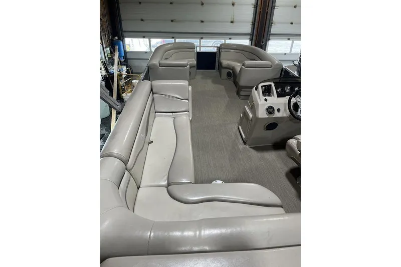 The Image of 2018 Bennington 23 SLX pontoon boat interior with spacious seating and helm. - 1