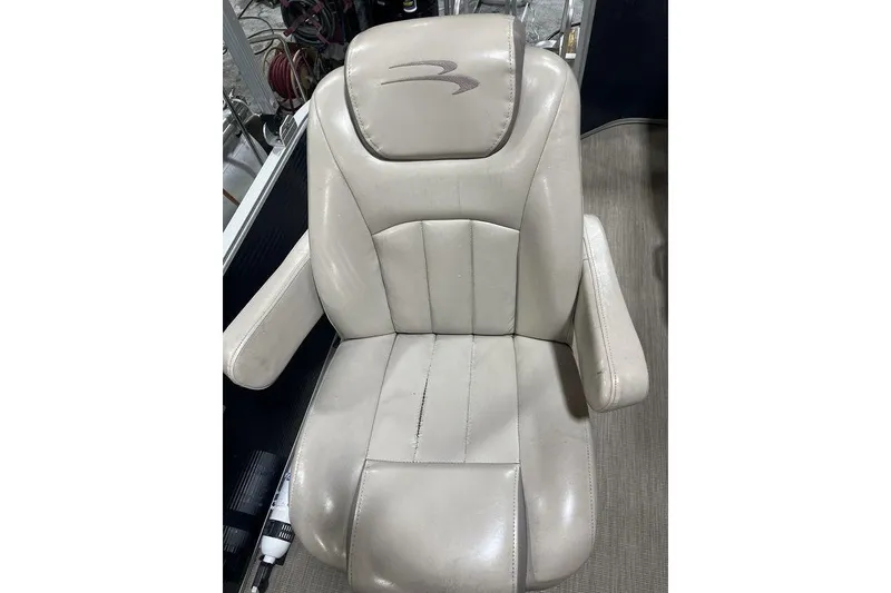 Slide: The Image of 2018 Bennington 23 SLX boat seat, beige leather with armrests and logo. - 11