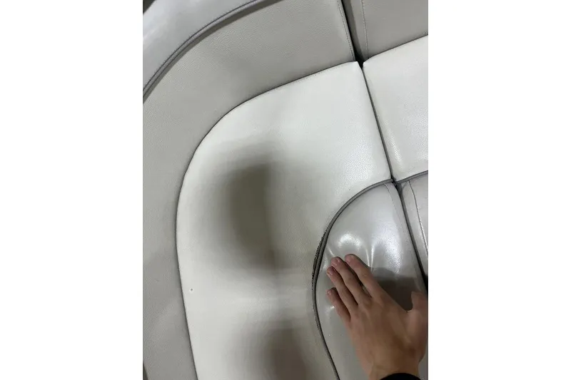 Slide: The Image of Hand touching white leather seat on 2018 Bennington 23 SLX boat. - 13