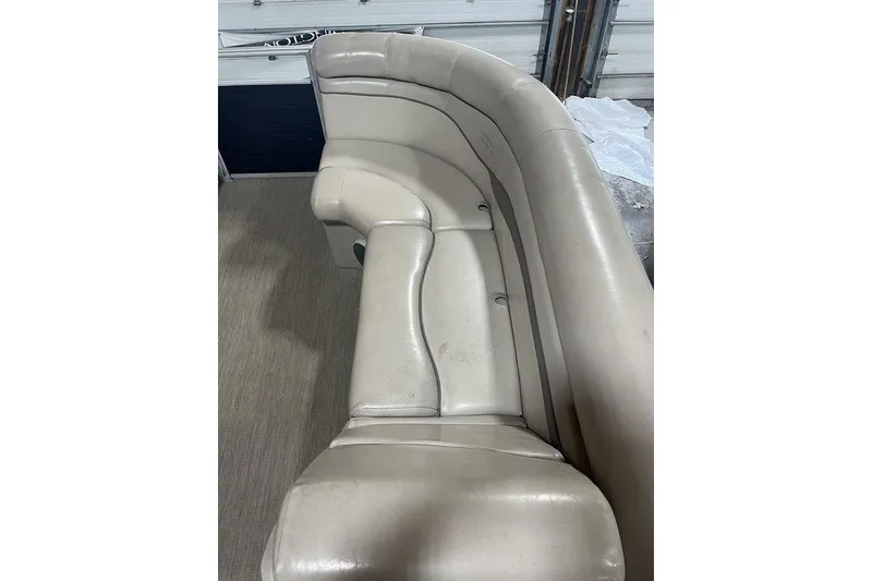 Slide: The Image of 2018 Bennington 23 SLX boat interior with beige leather seating. - 6