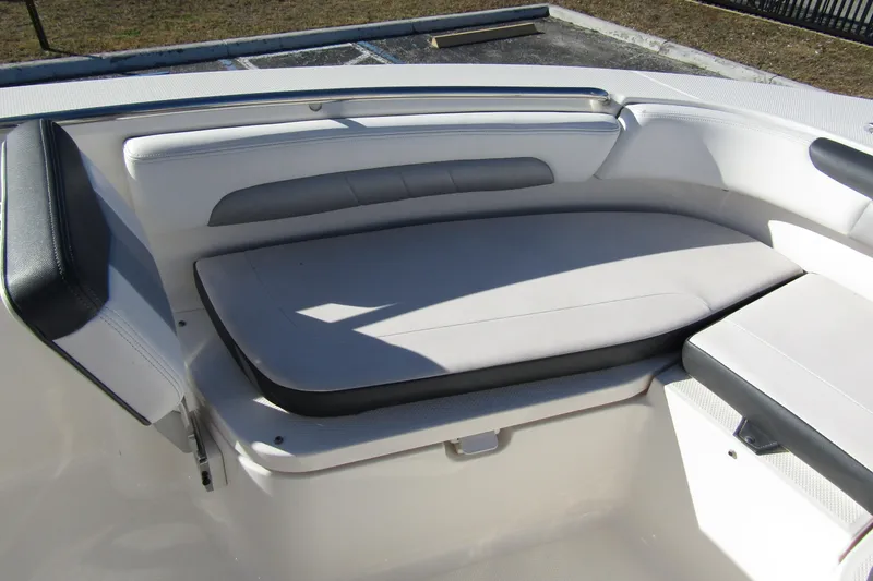 Slide: The Image of 2019 Robalo R202 Explorer boat interior seating with cushioned bench. - 10