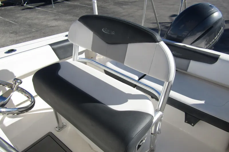 Slide: The Image of 2019 Robalo R202 Explorer boat interior with seating and steering wheel. - 16