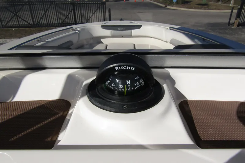 Slide: The Image of Compass on 2019 Robalo R202 Explorer boat dashboard, close-up view. - 18