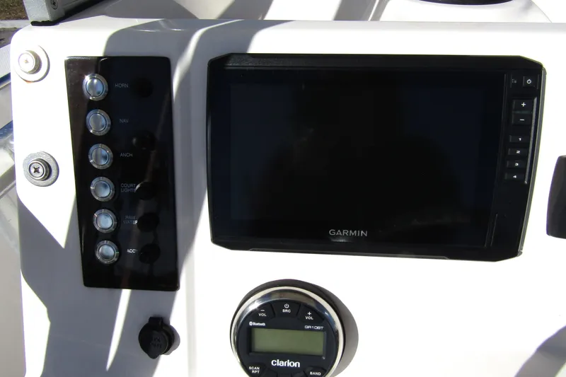 Slide: The Image of 2019 Robalo R202 Explorer dashboard with Garmin display and control panel. - 19