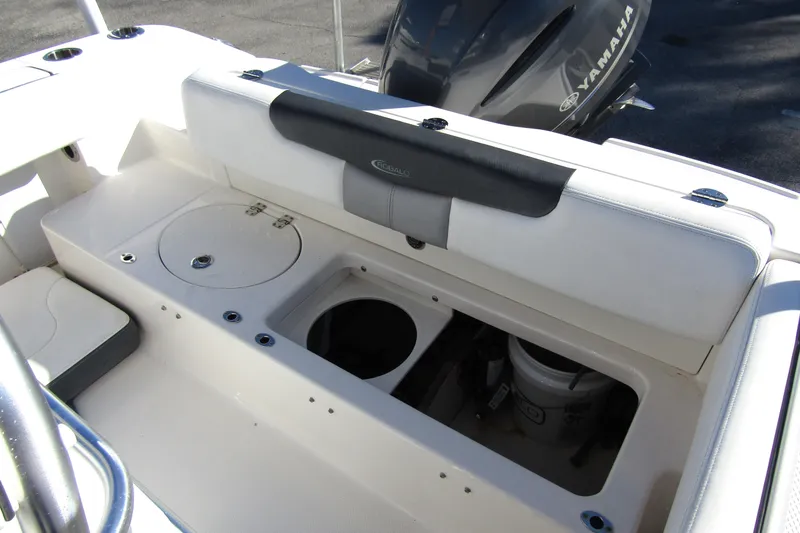 Slide: The Image of 2019 Robalo R202 Explorer boat interior with Yamaha engine, featuring storage compartments. - 25