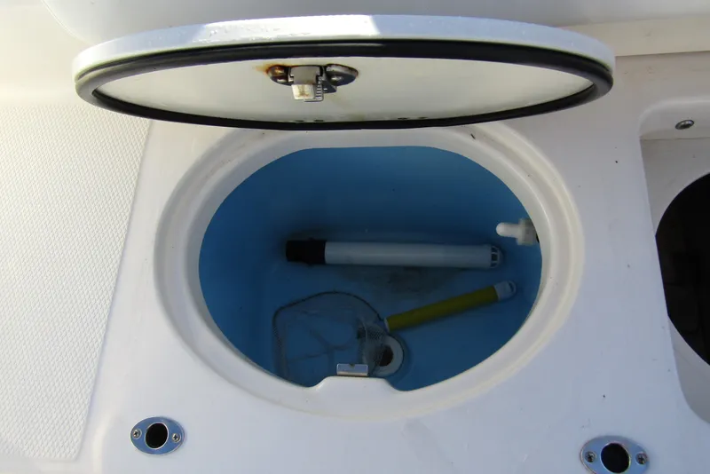 Slide: The Image of Open storage compartment on 2019 Robalo R202 Explorer boat, showing interior details. - 26