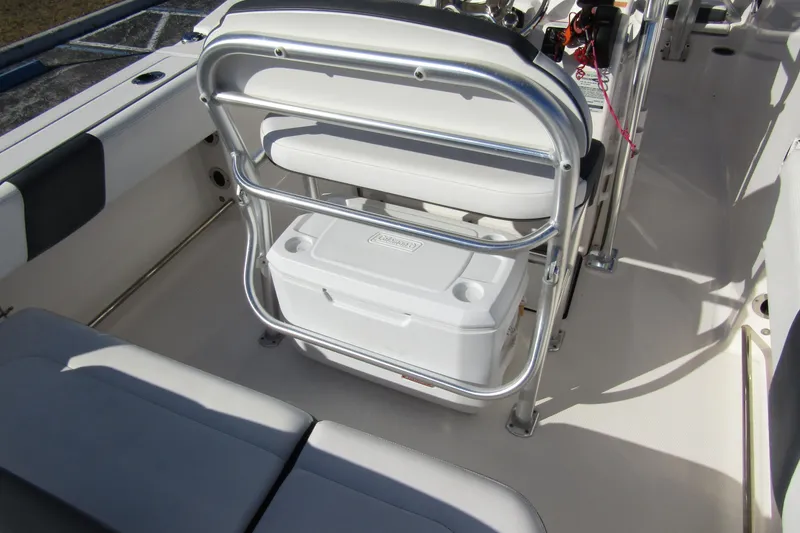 Slide: The Image of 2019 Robalo R202 Explorer boat interior with seating and cooler storage. - 29
