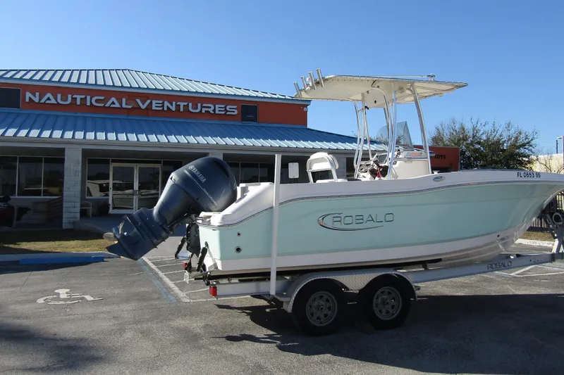 Slide: The Image of 2019 Robalo R202 Explorer boat on trailer at Nautical Ventures dealership. - 3