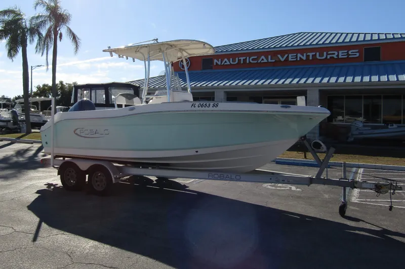 Slide: The Image of 2019 Robalo R202 Explorer boat on trailer at Nautical Ventures dealership. - 5