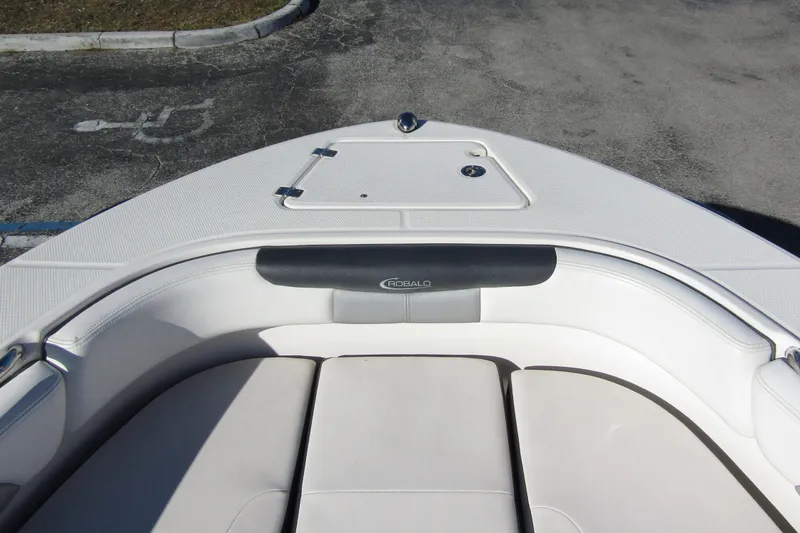 Slide: The Image of 2019 Robalo R202 Explorer boat interior with cushioned seating and storage compartment. - 7