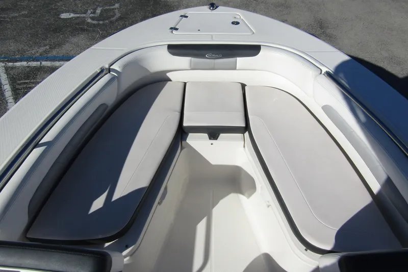 Slide: The Image of 2019 Robalo R202 Explorer boat interior with cushioned seating and storage. - 8