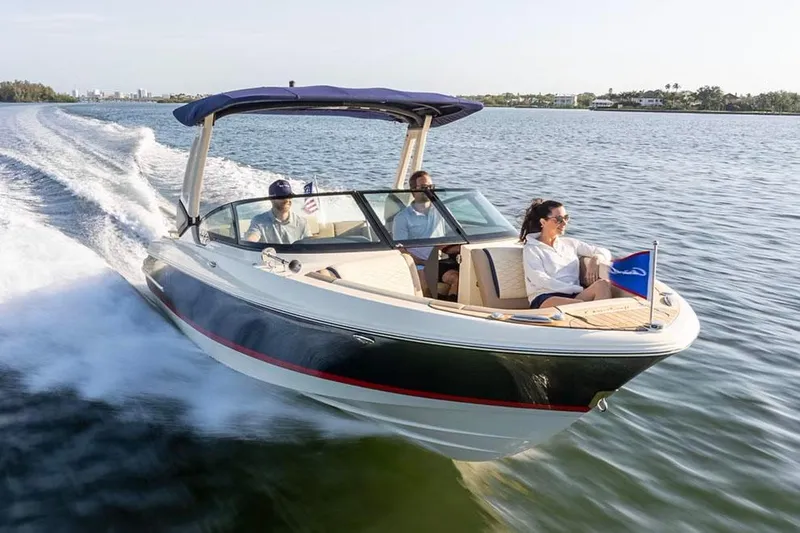 The Image of Manufacturer Provided Image: 2025 Chris-Craft Sportster 25 boat cruising on a lake with passengers. - 0