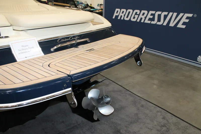 Slide: The Image of 2026 Chris-Craft Sportster 25 boat at Progressive event, showcasing elegant design and craftsmanship. - 19