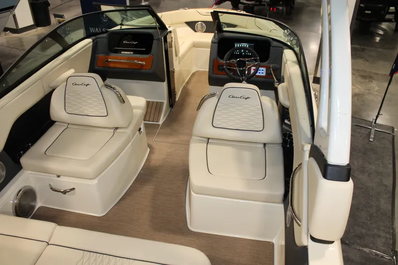 Slide: The Image of 2026 Chris-Craft Sportster 25 interior with luxurious seating and modern dashboard design. - 23