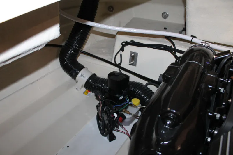 Slide: The Image of Engine compartment of 2026 Chris-Craft Sportster 25, showcasing mechanical components and wiring. - 27