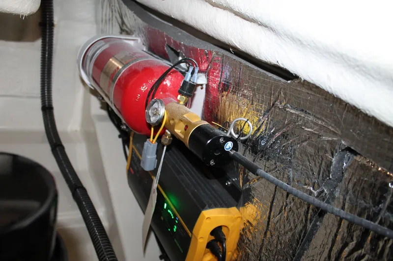 Slide: The Image of Engine compartment of 2026 Chris-Craft Sportster 25 with fire suppression system. - 28