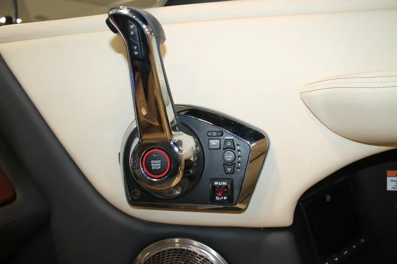 Slide: The Image of 2026 Chris-Craft Sportster 25 control panel with start-stop button and throttle lever. - 35