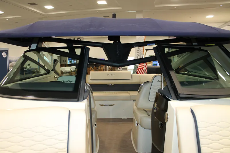 Slide: The Image of 2026 Chris-Craft Sportster 25 boat interior with seating and canopy. - 44