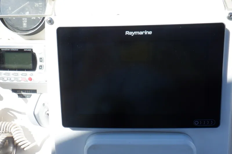 Slide: The Image of Marine Trader 47 Tradewinds 1990 dashboard with Raymarine display and navigation instruments. - 14
