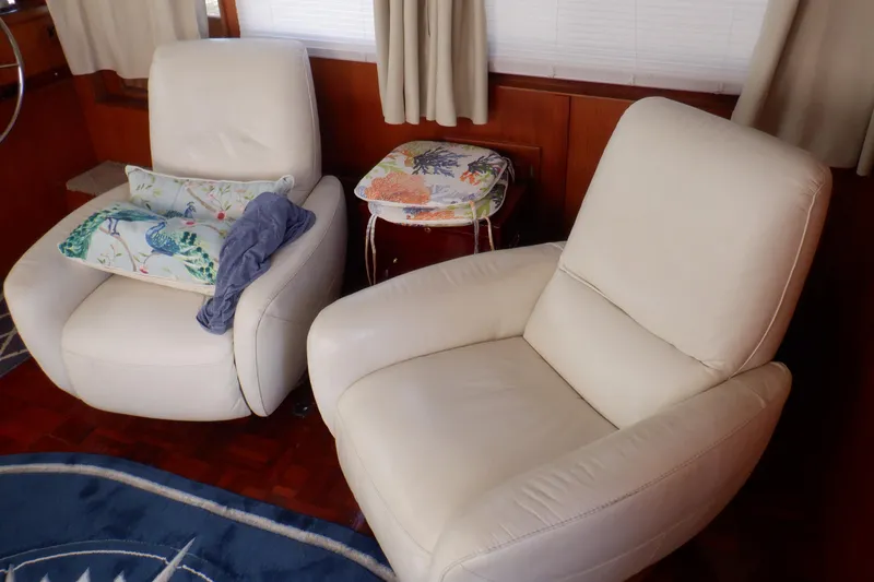 Slide: The Image of Cream leather chairs in a 1990 Marine Trader 47 Tradewinds yacht interior. - 21