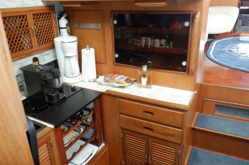 Slide: The Image of Galley of 1990 Marine Trader 47 Tradewinds yacht with coffee maker and liquor bottle. - 30