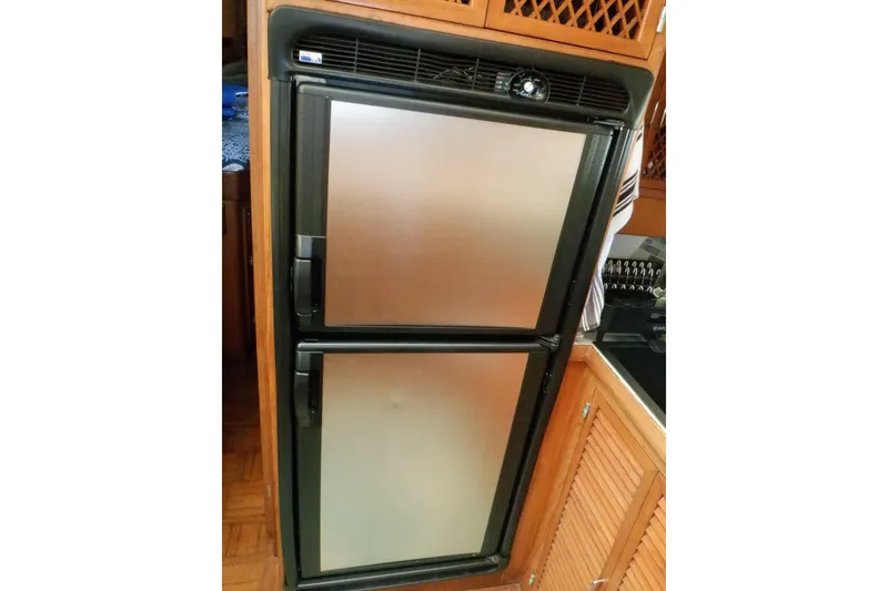 Slide: The Image of Built-in refrigerator in 1990 Marine Trader 47 Tradewinds yacht kitchen. - 34