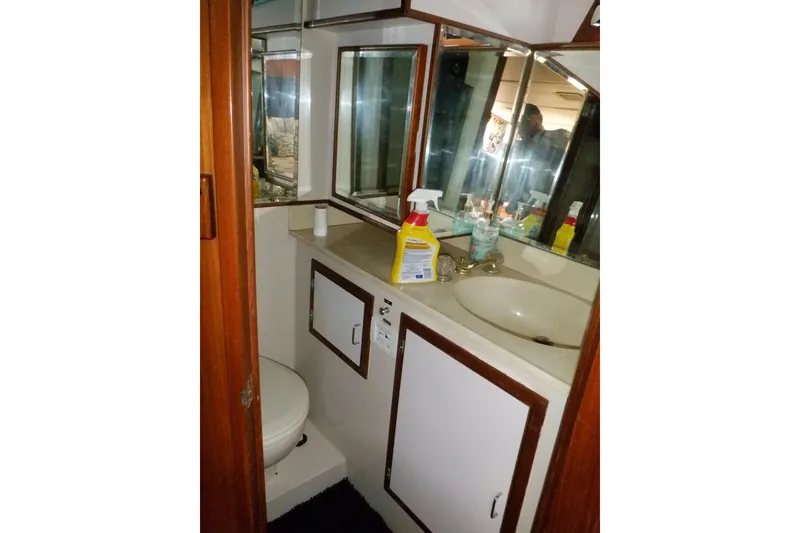 Slide: The Image of Bathroom interior of 1990 Marine Trader 47 Tradewinds yacht, featuring sink and toilet. - 45