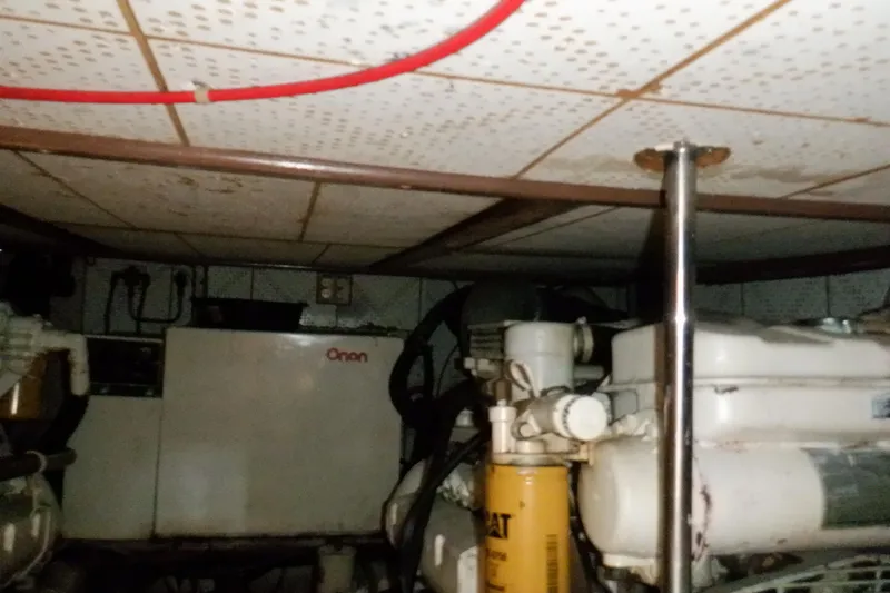 Slide: The Image of Engine room of a 1990 Marine Trader 47 Tradewinds with Onan generator. - 50