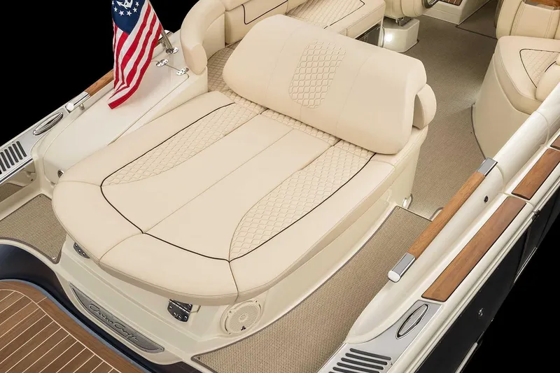 Slide: The Image of Manufacturer Provided Image: Luxurious 2025 Chris-Craft Launch 28 GT boat interior with beige seating and American flag. - 15