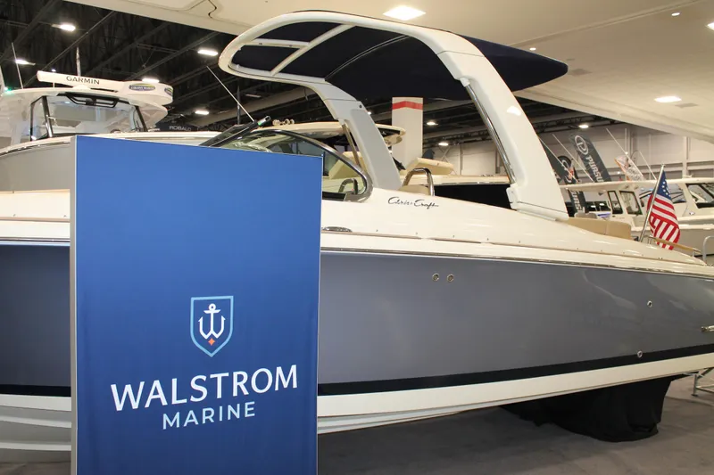 Slide: The Image of 2026 Chris-Craft Launch 28 GT boat displayed at Walstrom Marine showroom. - 20