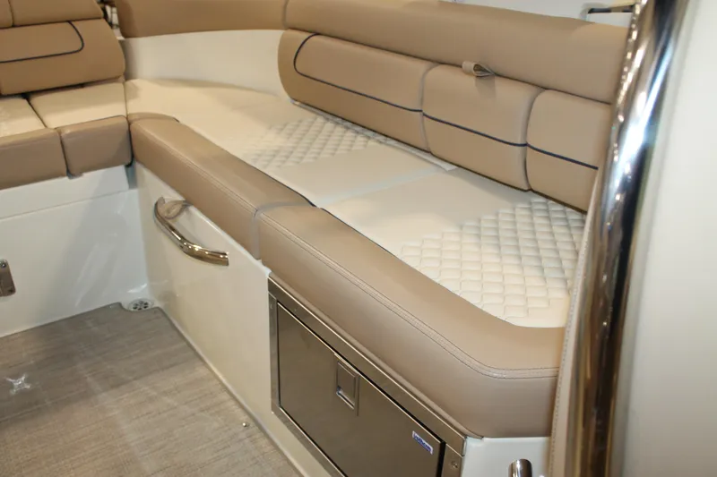 Slide: The Image of 2026 Chris-Craft Launch 28 GT interior with luxurious beige seating and stainless steel accents. - 29