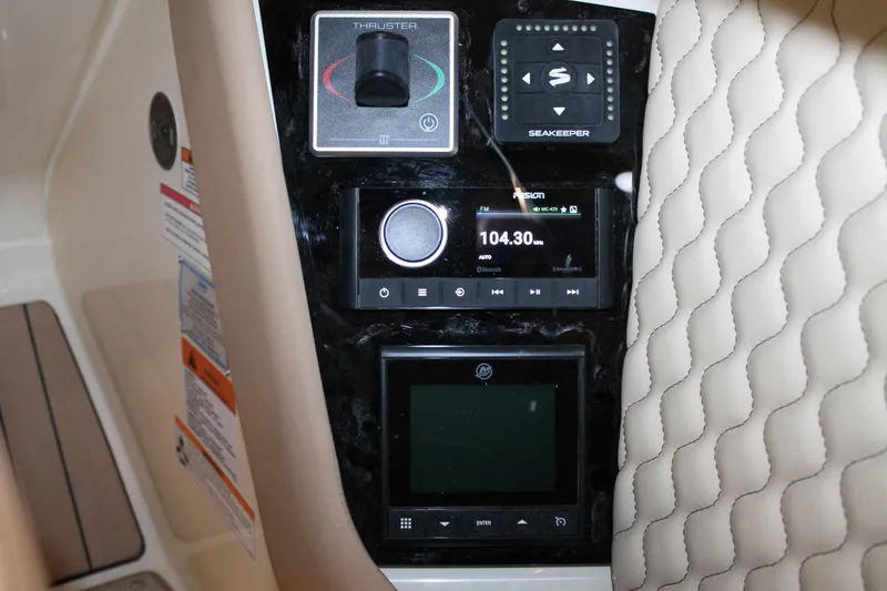 Slide: The Image of Control panel of 2026 Chris-Craft Launch 28 GT with radio and navigation systems. - 37