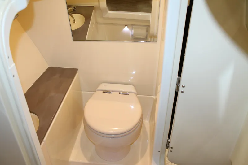 Slide: The Image of 2026 Chris-Craft Launch 28 GT boat bathroom with toilet and sink. - 40