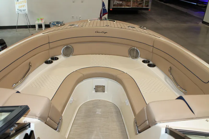 Slide: The Image of 2026 Chris-Craft Launch 28 GT boat interior with beige seating and stainless steel accents. - 41