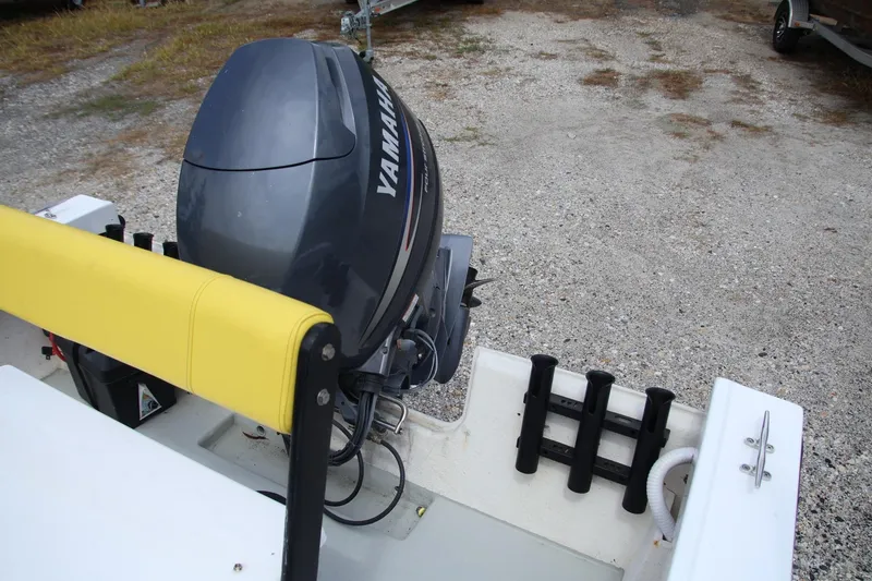 Slide: The Image of 1988 Parker 1801 Center Console boat with Yamaha outboard motor and yellow seat. - 13