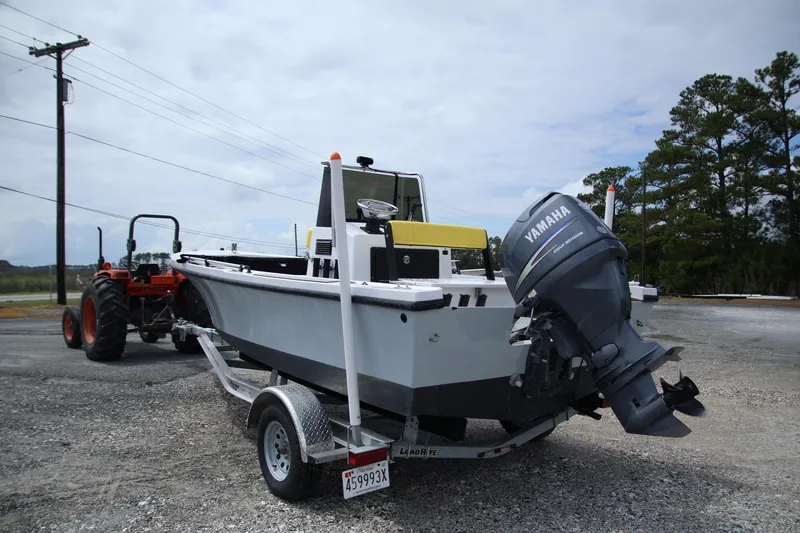 Slide: The Image of 1988 Parker 1801 Center Console boat with Yamaha outboard motor on trailer. - 3