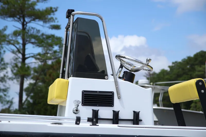 Slide: The Image of 1988 Parker 1801 Center Console boat with yellow accents and steering wheel. - 6