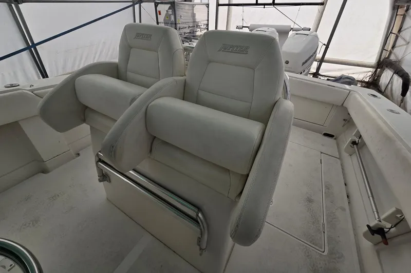 Slide: The Image of 2010 Jupiter 34 FS boat interior with dual cushioned seats. - 12