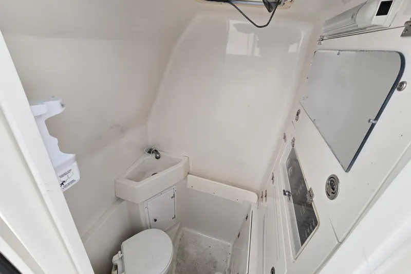 Slide: The Image of 2010 Jupiter 34 FS boat bathroom with sink and toilet. - 13