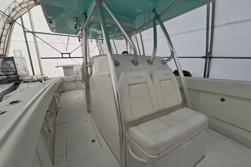 Slide: The Image of 2010 Jupiter 34 FS boat interior with white seating and metal framework. - 19