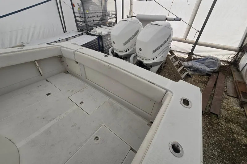 Slide: The Image of 2010 Jupiter 34 FS boat with twin Mercury outboard engines in storage. - 21