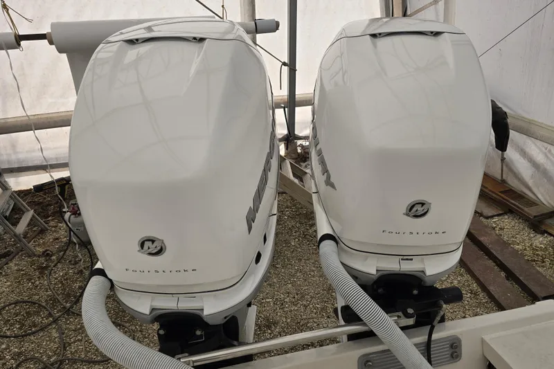 Slide: The Image of Twin Mercury FourStroke outboard engines on a 2010 Jupiter 34 FS boat. - 23