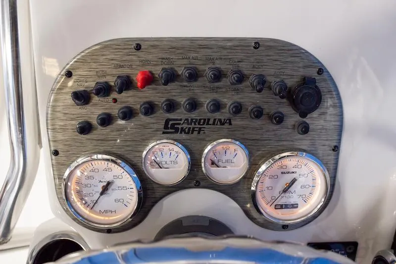 Slide: The Image of Manufacturer Provided Image: Dashboard of 2026 Carolina Skiff 19 LS boat with gauges and controls. - 8